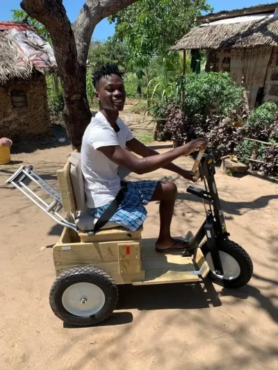 Kenya-PFC-man-young-missing-leg-w-on-cart-2021